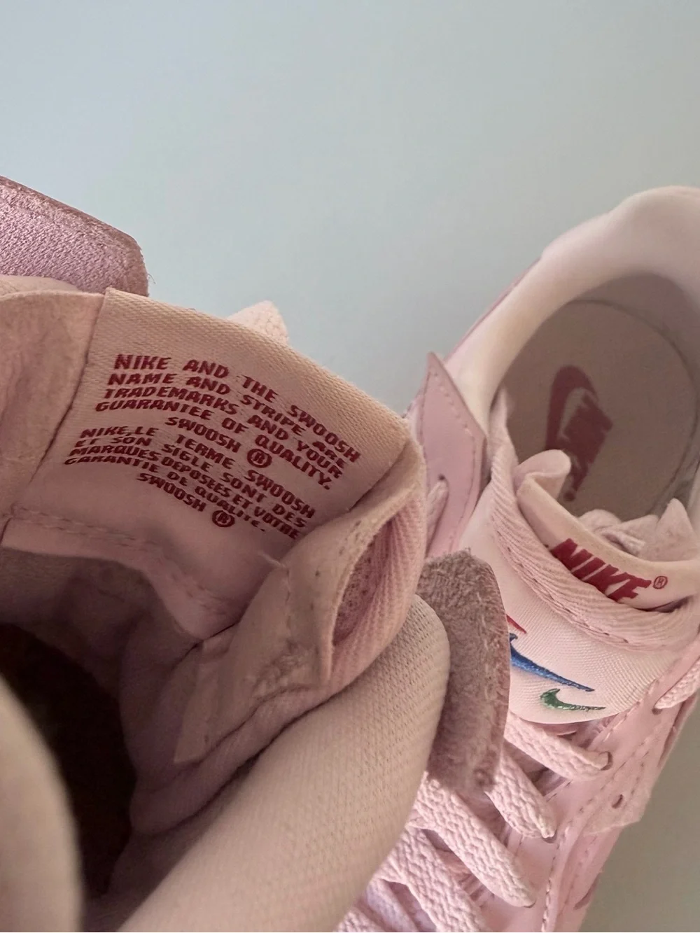 Nike Air Force 1 Women’s Light Pink Low-Top Sneakers with Red Accent
